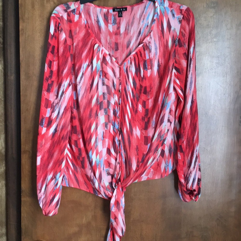 Tie from long sleeve blouse